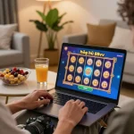 Nổ hũ 88vv gameplay displayed on laptop, player focusing on vibrant online slot game in a cozy home setup.